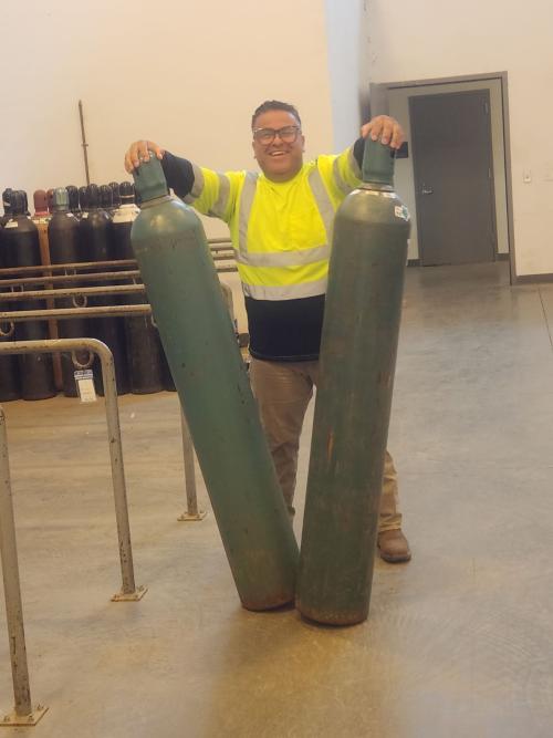 Alberto Cardenas with Gas Cylinders