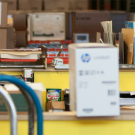 two men working in a warehouse space