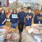 Photo of SCM Staff with Donated Food Items