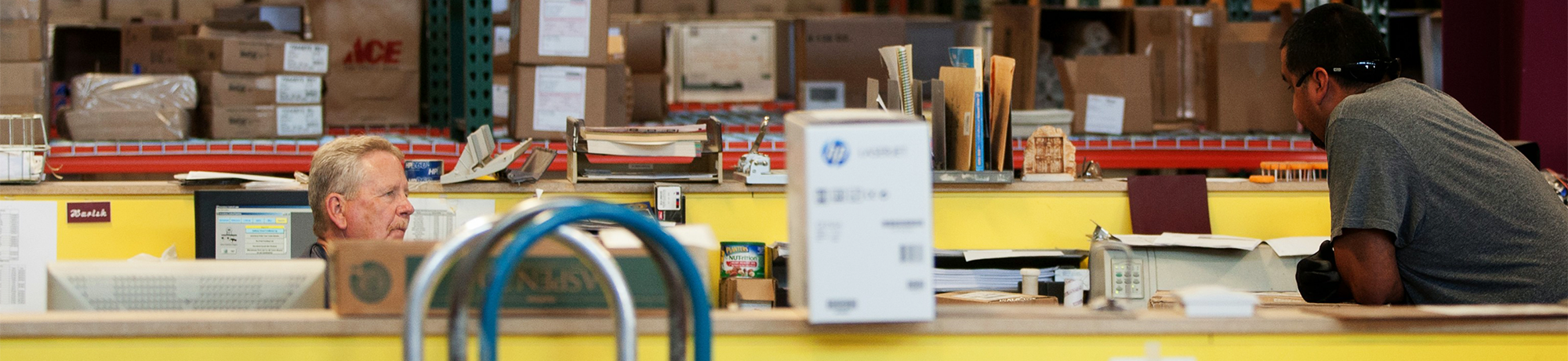 two men working in a warehouse space