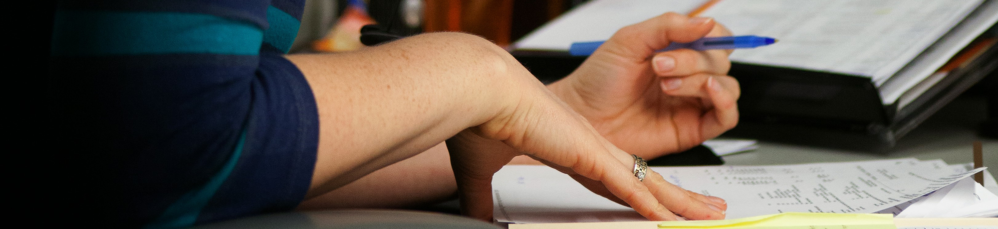 women's hands looking at receipts